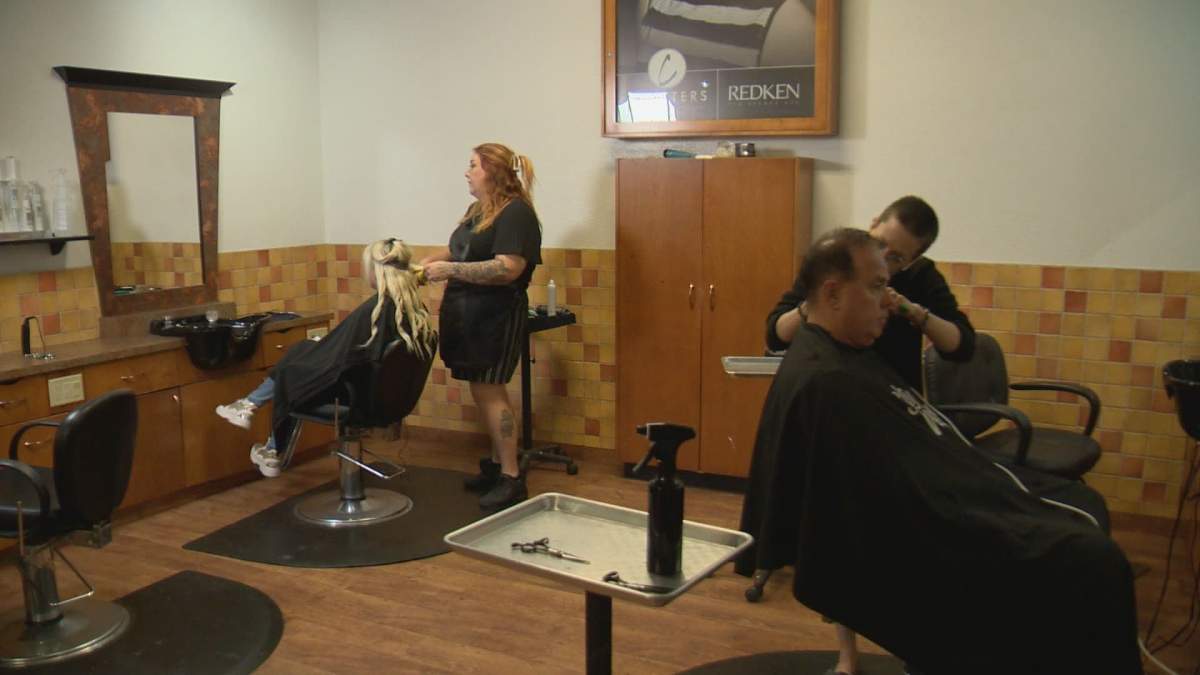 ROCELYN HODSONStylist and service manager at Chatters styling a client’s hair as she gets ready to leave for New York Fashion Week.