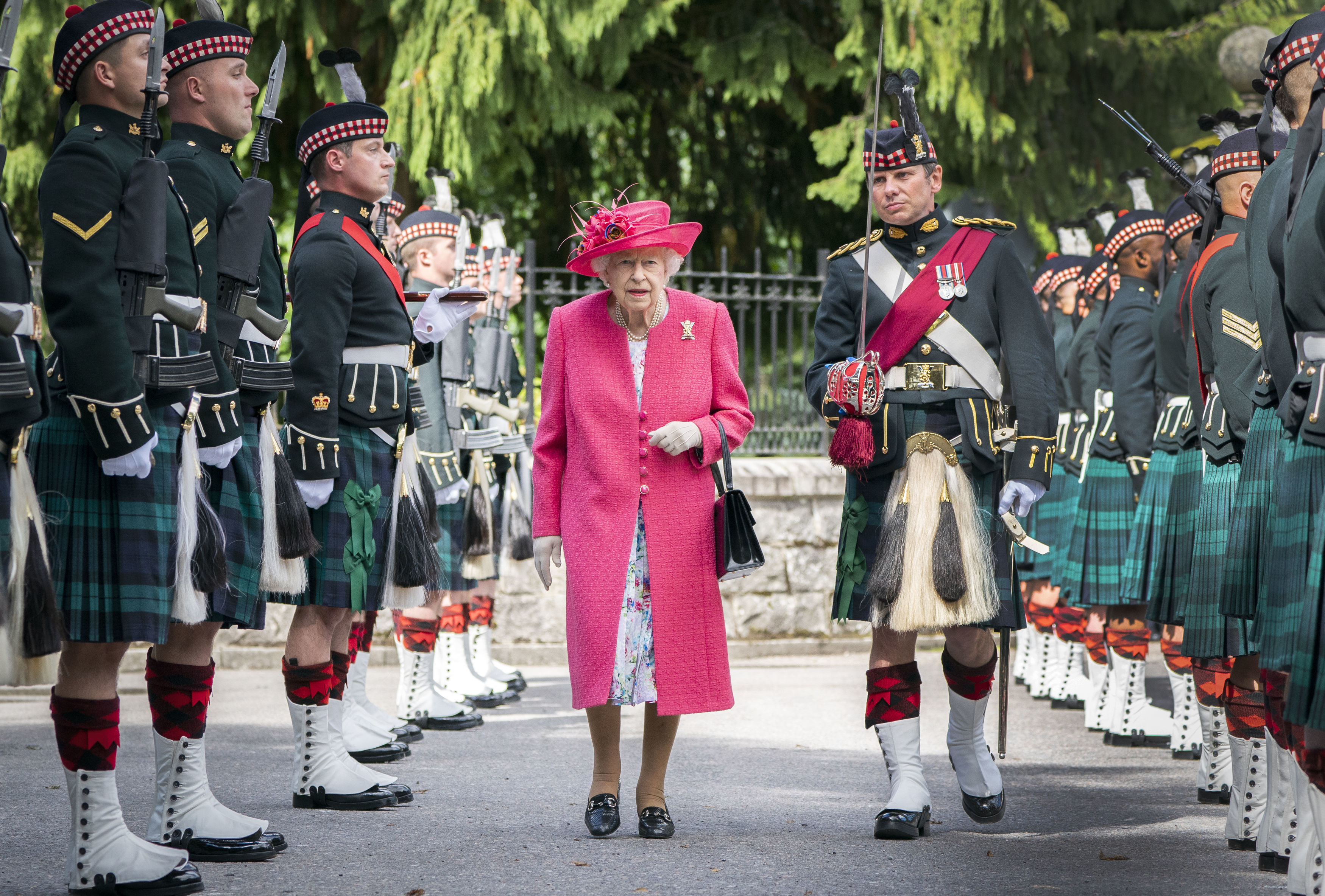 Queen Elizabeth II during an inspection of the Balaklava Company, 5 Battalion The Royal Regiment of Scotland at the gates at Balmoral, as she takes up summer residence at the castle, on August 9, 2021 in Ballater, Aberdeenshire.