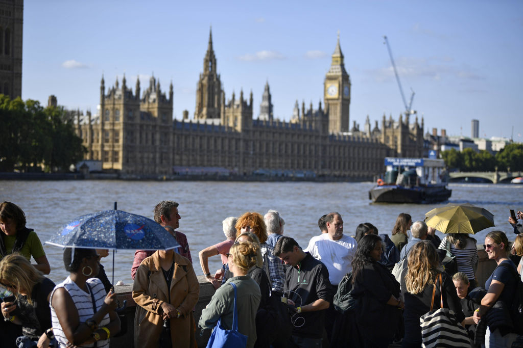 Members of the public wait in line in central London, to view Queen Elizabeth II lying in state in Westminster Hall ahead of her funeral on Monday.