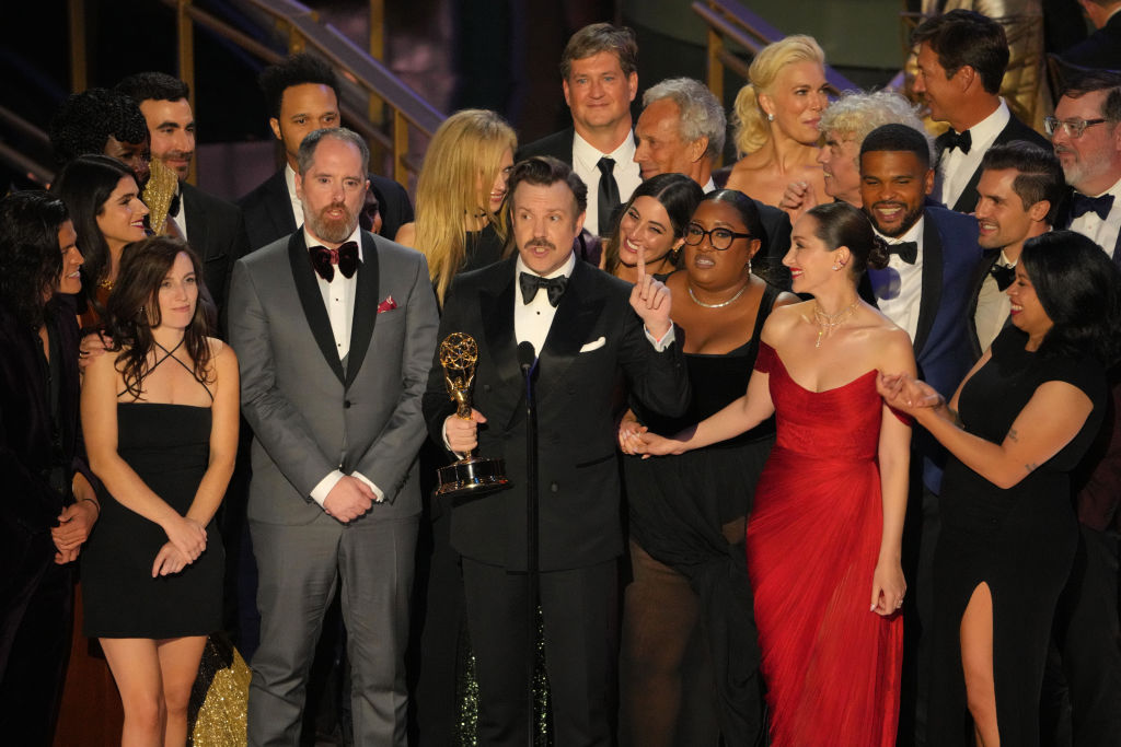 Jason Sudeikis (C) and cast and crew of 'Ted Lasso' accept the Outstanding Comedy Series onstage during the 74th Primetime Emmys at Microsoft Theater on September 12, 2022 in Los Angeles, California.