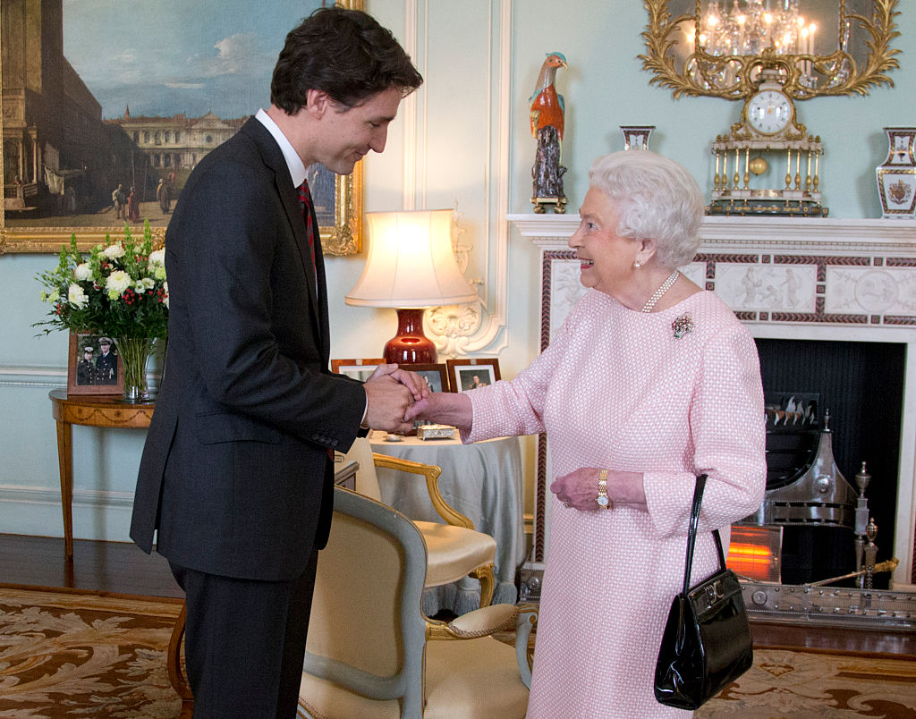 Prime Minister of Canada Justin Trudeau shake hands with Queen Elizabeth II during a private audience at Buckingham Palace on November 25, 2015 in London, England. This is the first visit of Trudeau in Britain since his election as Canada's Prime Minister.