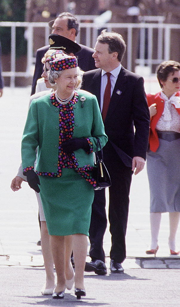 Queen Elizabeth II arrives with her private secretary Robin Janvrin on tour in Budapest, Hungary in 1993.
