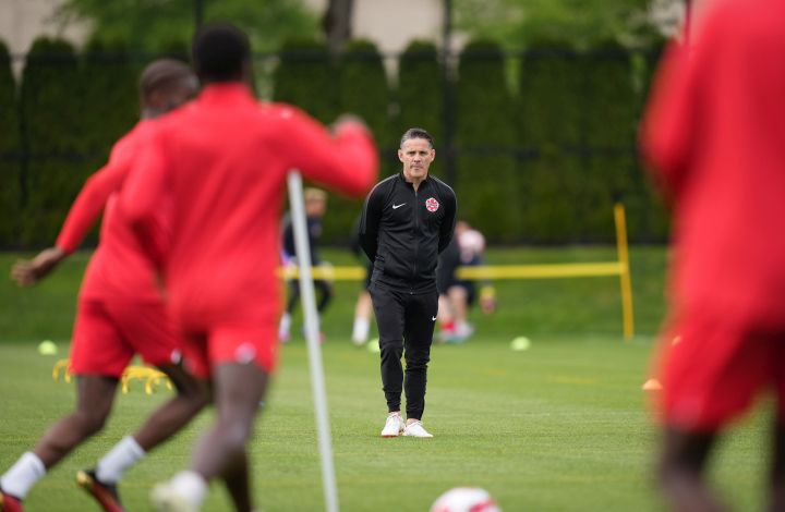 Canadian national men's soccer team head coach John Herdman watches a training session for a CONCACAF Nations League match against Curacao, in Vancouver, on Tuesday, June 7, 2022. 