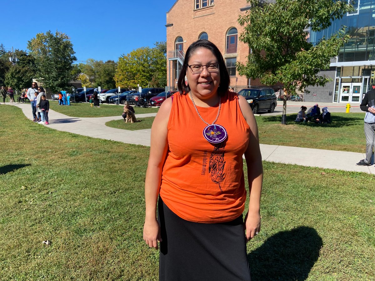 Lori George, of Oneida of the Thames First Nation, wearing a pendant in honour of her brother she lost to suicide.