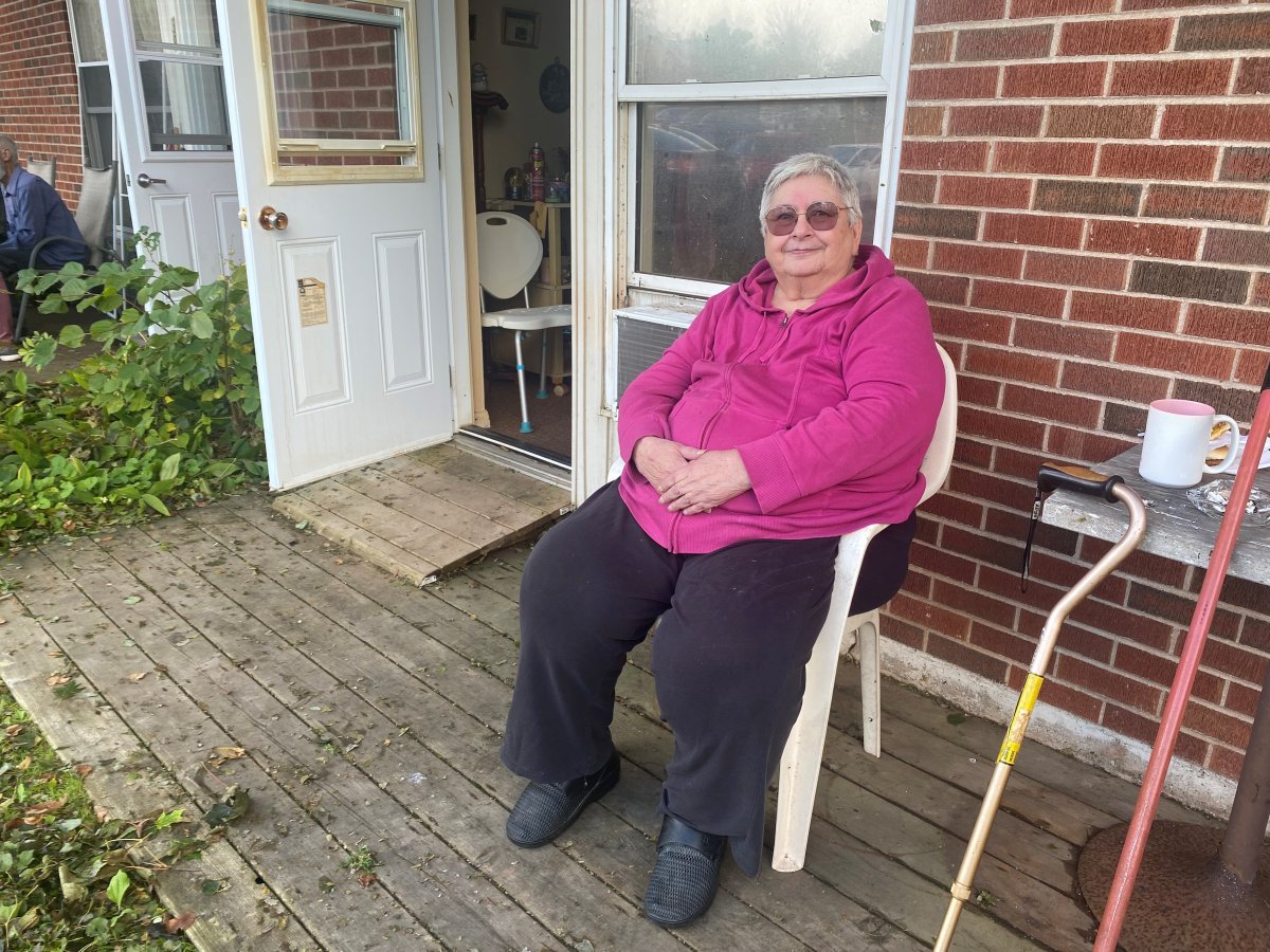 Joan Peters sits outside her unit in a senior's complex in Charlotetown.