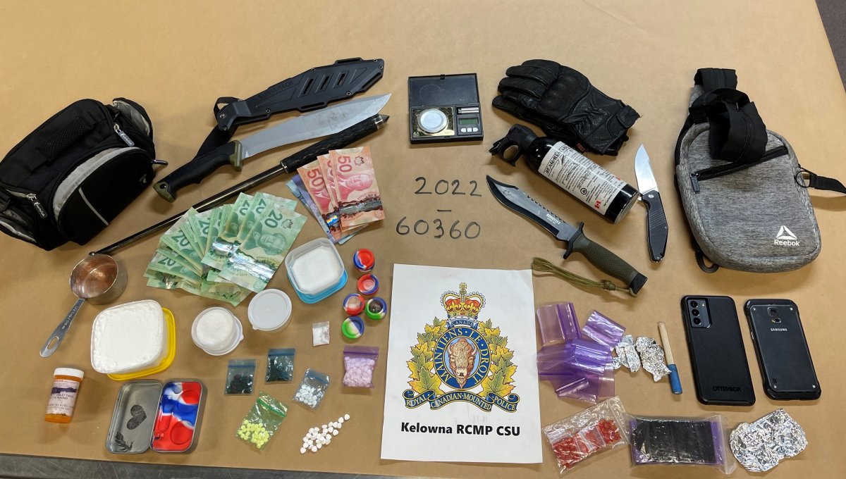 A police photo of the drugs, weapons and money seized during an arrest in downtown Kelowna last week.