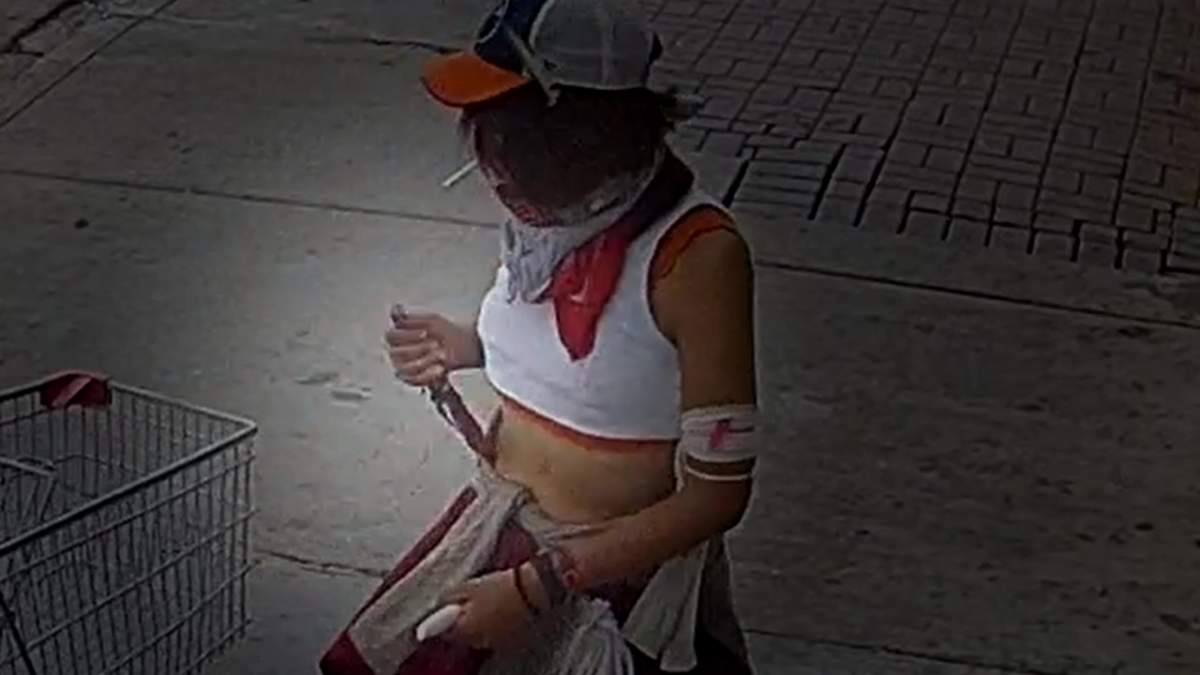 Screenshot from a video showing two women interacting on 100 Street near 106 Avenue in Chinatown before one is arrested by Edmonton police on Thursday, Sept. 15, 2022. One of the women was armed with a knife.