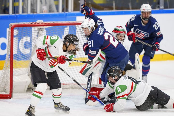 Hilary Knight of the United States, number 2, in action with Alexandra Huszak and Taylor Baker of Hungary during The IIHF World Championship Woman’s ice hockey match between USA and Hungary in Herning, Denmark, Thursday, Sept. 1, 2022.
