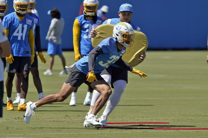 Los Angeles Chargers defensive back Deane Leonard (33) goes through a drill during an NFL football rookie minicamp, Friday, May 13, 2022, in Costa Mesa, Calif. Canadian Leonard has certainly taken the path less travelled to the NFL’s Los Angeles Chargers. The Calgary native helped the Calgary Dinos win a Vanier Cup, then transferred to Ole Miss before being selected in the seventh round of the ’22 NFL draft by the Chargers.