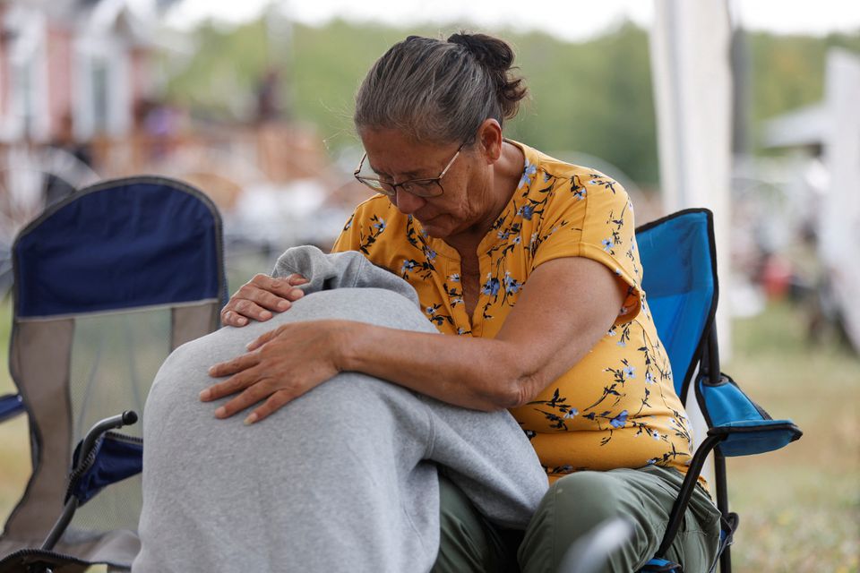 Annie Sanderson comforts her granddaughter, who was close with Gloria Lydia Burns, 62, who was killed on James Smith Cree Nation after a stabbing spree killed 10 people on the reserve and nearby town of Weldon, Saskatchewan, Canada. September 5, 2022.