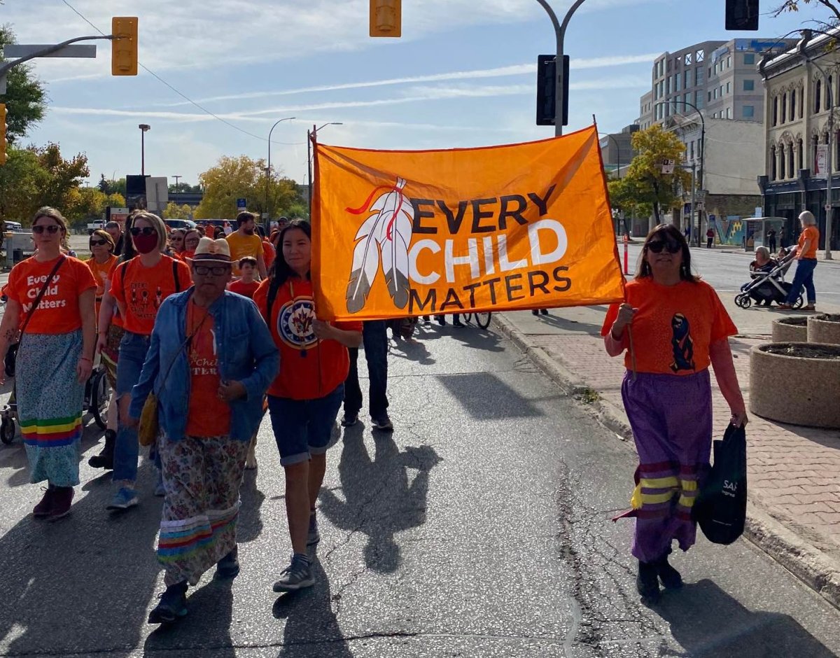 Winnipeggers walk downtown in recognition of Orange Shirt Day in this 2022 file photo.