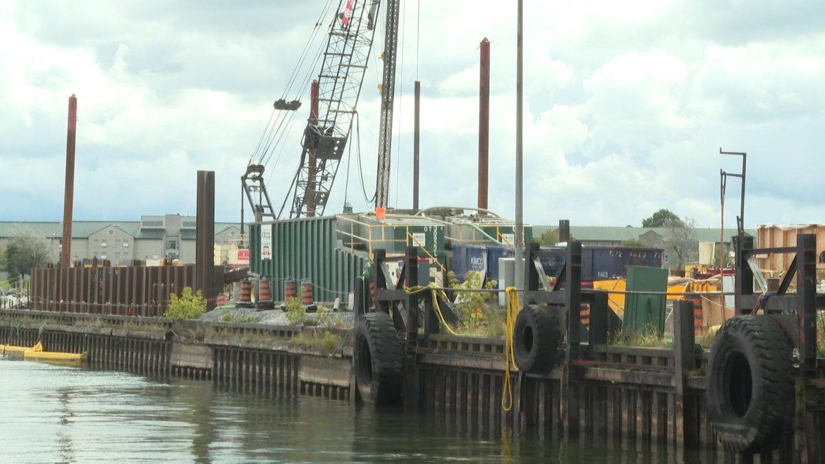 Work on the Wolfe Island ferry dock is scheduled to wrap up by year's end, bur residents are concerned about its progress.