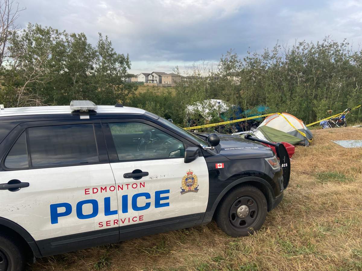 A homeless encampment surrounded by police tape Thursday, Sept. 8, 2022, one day after police said one person was killed and two seriously injured in random assaults in Edmonton's Homesteader neighbourhood.