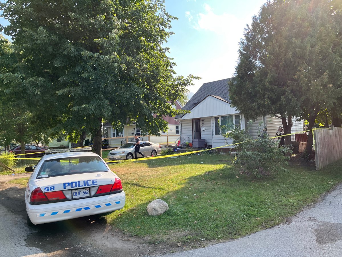 Officers with the London Police Service at the scene of a shooting on Flanders Row in northeast London, Ont. Police say they returned to the address later that night for a reported break and enter which ended with two in custody.