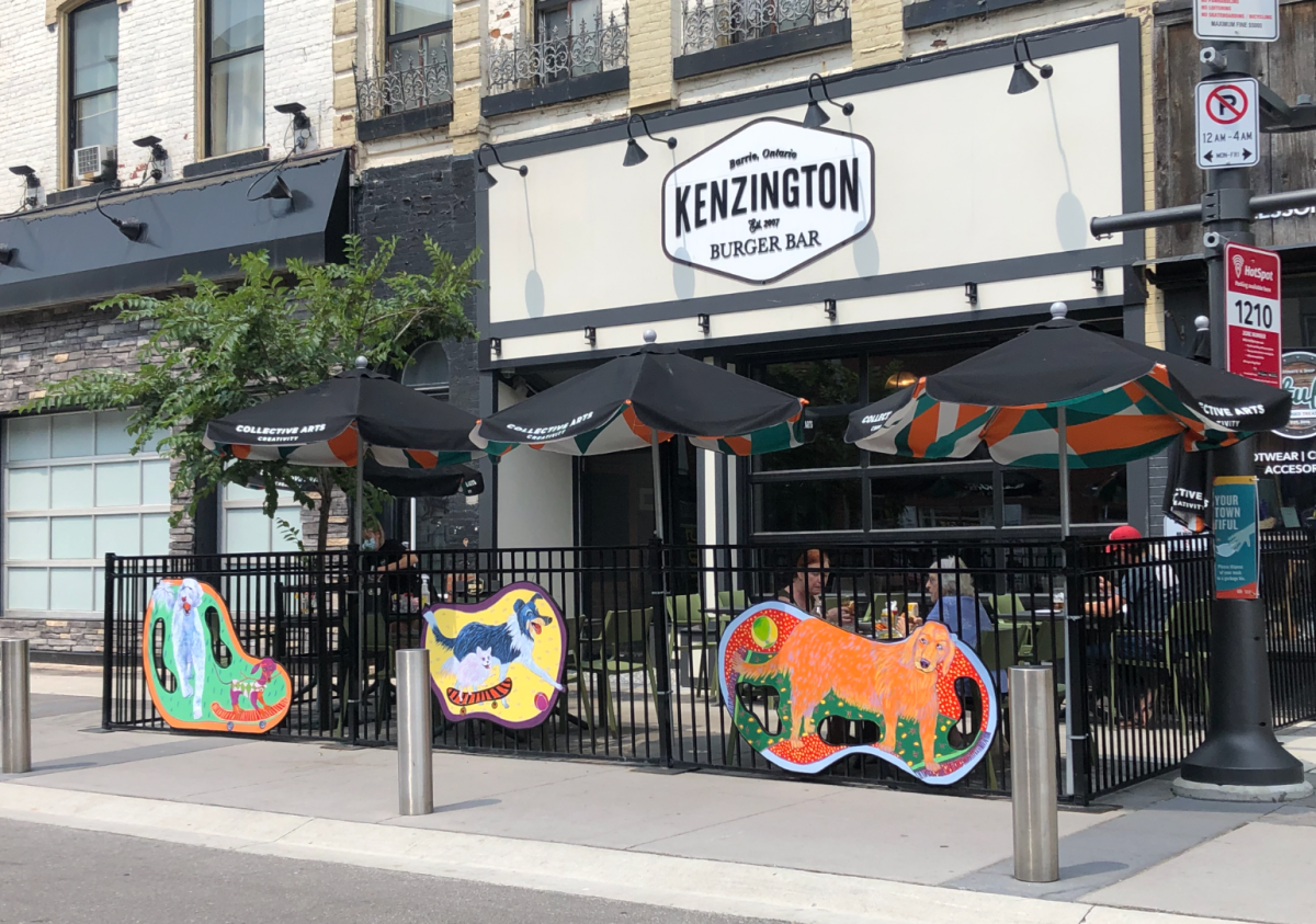 It’s a Dog’s Life by Christina Luck outside Kenzington Burger Bar 40 Dunlop Street East in Barrie Ontario.