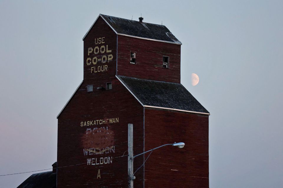 The moon rises behind a grain elevator as police conducted a manhunt, after multiple people were killed and injured in a stabbing spree in Weldon, Saskatchewan, Canada. September 4, 2022.