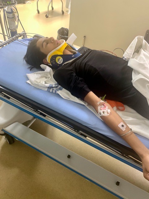 Saiva in a neck brace at Alberta Children’s Hospital.