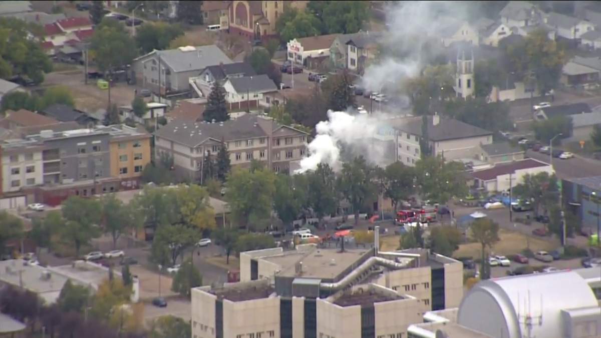 Fire crews battle a blaze at a home in the area of 96 Street and 105A Avenue Monday, Sept. 26, 2022.