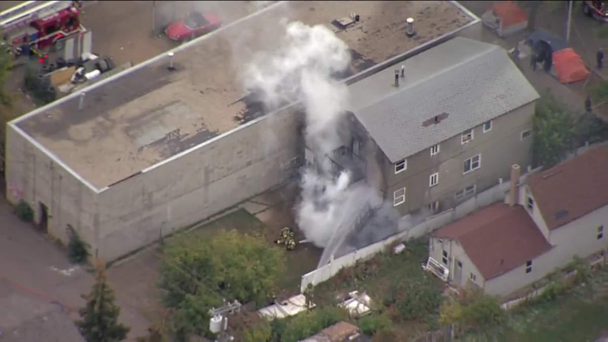 Fire crews battle a blaze at a home in the area of 96 Street and 105A Avenue Monday, Sept. 26, 2022.