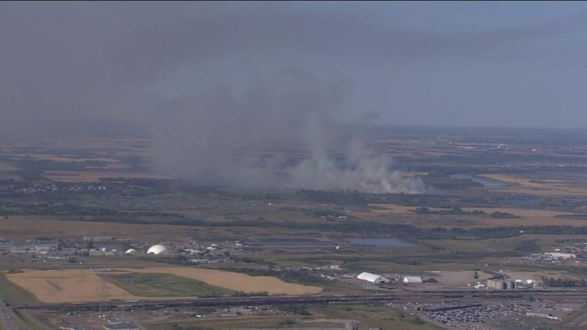 A grassfire burns northeast of Edmonton Wednes