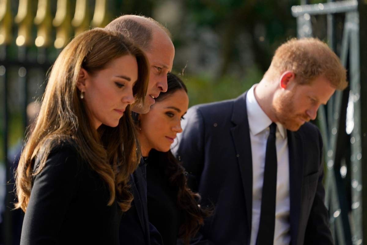Britain's Prince William and Kate Middleton, Princess of Wales, left, and Britain's Prince Harry and Meghan Markle, Duchess of Sussex, walk to greet the crowds after viewing the floral tributes for the late Queen Elizabeth II outside Windsor Castle, in Windsor, England, Saturday, Sept. 10, 2022.