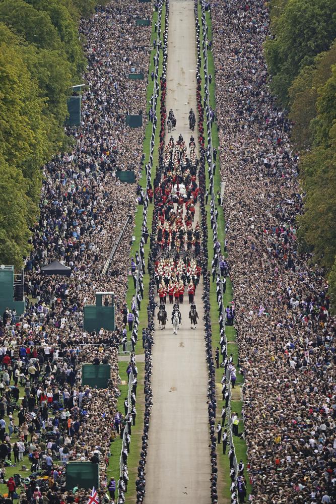 The Ceremonial Procession of the coffin of Queen Elizabeth II travels down the Long Walk as it arrives at Windsor Castle for the Committal Service at St George’s Chapel, in Windsor, England, Monday, Sept. 19, 2022.