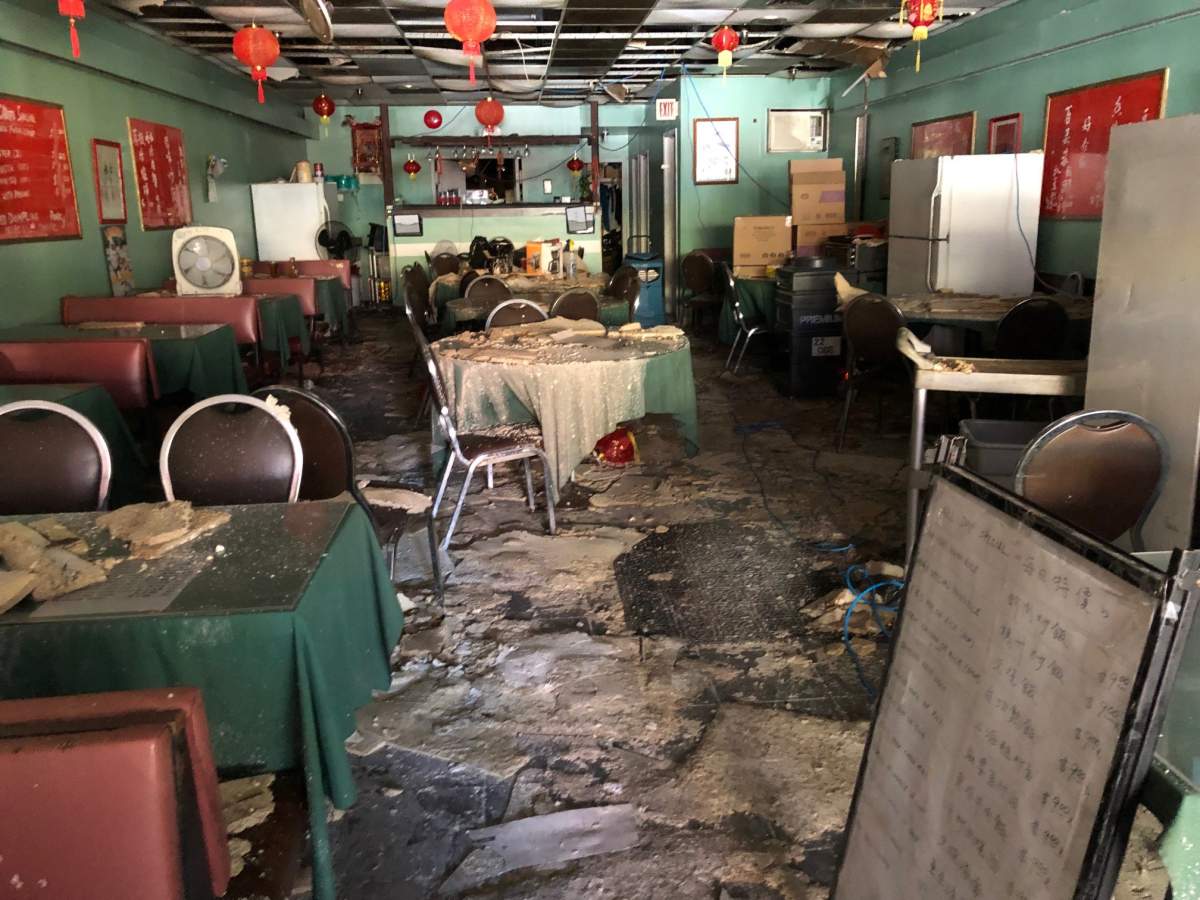Water damage inside the Gain Wah restaurant dining room on Sunday September 18, 2022.