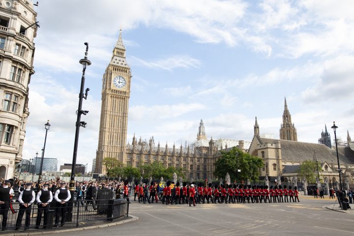  The coffin carrying Queen Elizabeth II makes its way along Big Ben and Westminster Hall during the procession for the Lying-in State of Queen Elizabeth II on September 14, 2022 in London, England.