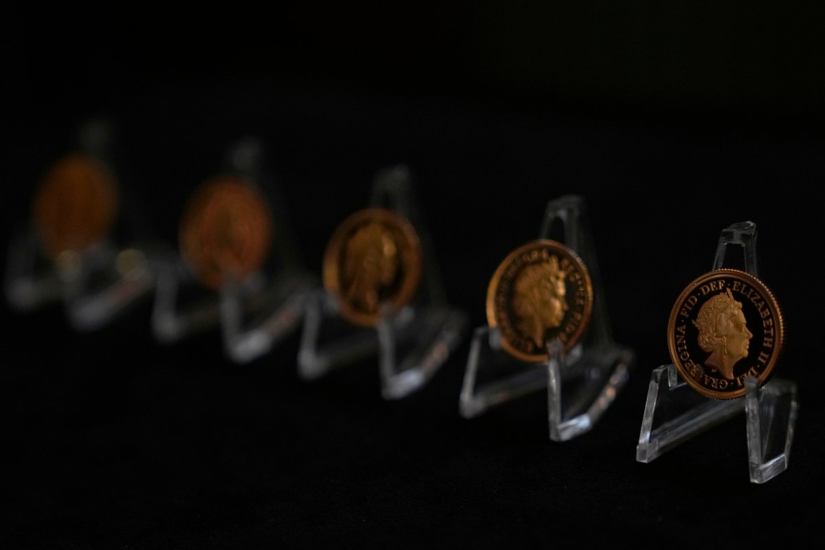 Five gold sovereigns bearing the official portraits of the late Queen Elizabeth II, on display by the Royal Mint in London, Thursday, Sept. 29, 2022. The official portrait of the monarch is updated during their reign.