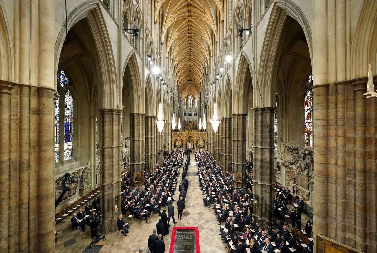 Guests arrive inside Westminster Abbey ahead of The State Funeral of Britain's Queen Elizabeth II, in London Monday Sept. 19, 2022.
