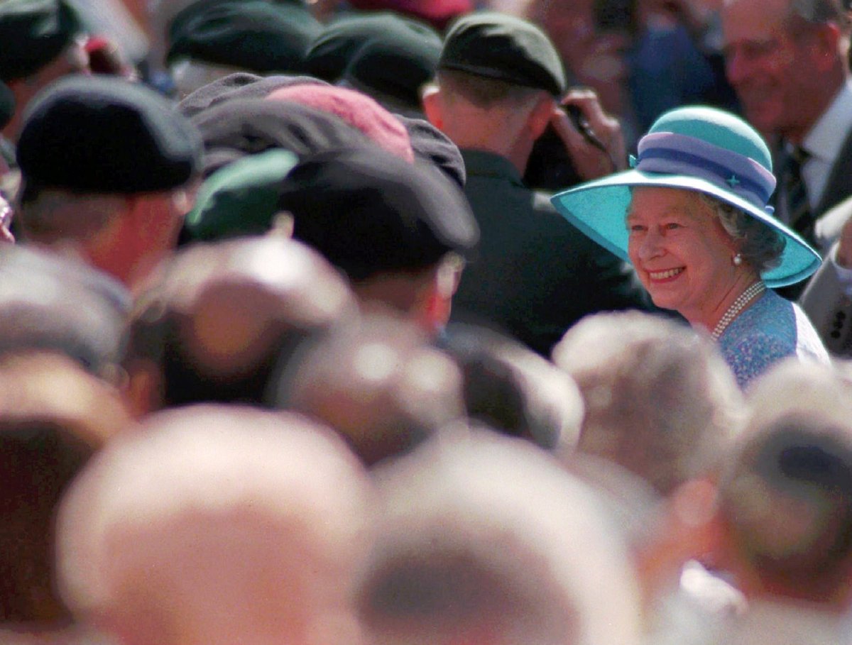 Queen Elizabeth II of England smiles as she meets with the public during a visit to Victoria Park in London, Ontario, June 26, 1997.