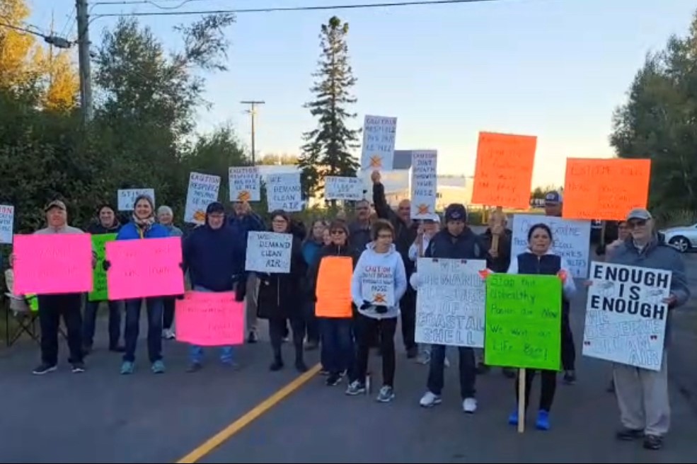 Residents are seen staging a road block in Richibucto to protest Coastal Shell Products’ facility.