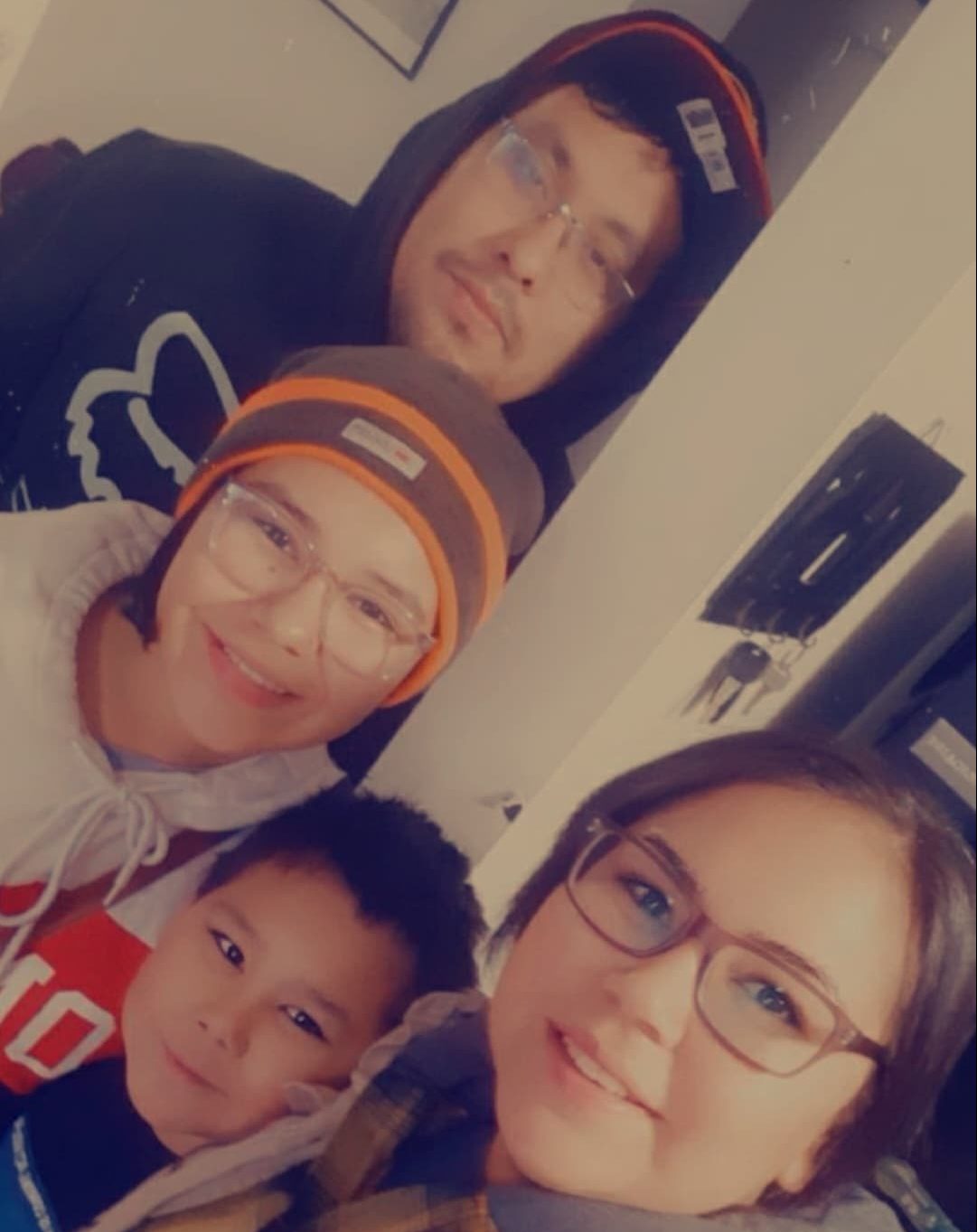 Damien and Skye Sanderson, pictured with two of their three children.