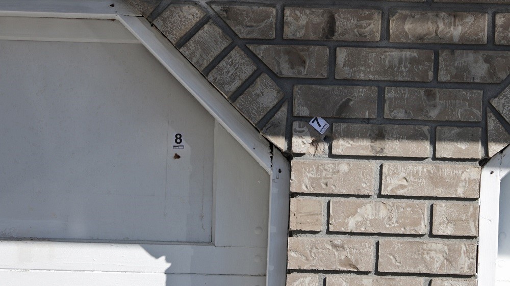 Apparent bullet holes were seen on the side of a home in Surrey, Sunday morning.
