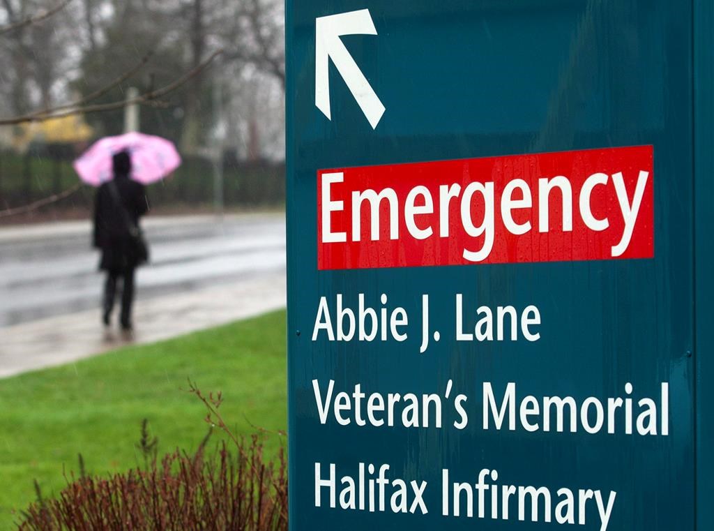 A  person walks past the Halifax Infirmary hospital in Halifax on Tuesday, April 24, 2012. Nova Scotia’s registry of people in need of primary care climbed to 116,000 this month — a record high. THE CANADIAN PRESS/Andrew Vaughan.