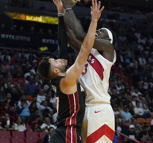 After a scuffle, Heat hold on to top Raptors 112-109