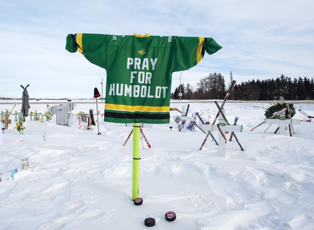 A memorial for the 2018 crash where 16 people died and 13 injured when a truck collided with the Humboldt Broncos hockey team bus, is shown at the crash site on Wednesday, January 30, 2019 in Tisdale, Saskatchewan.