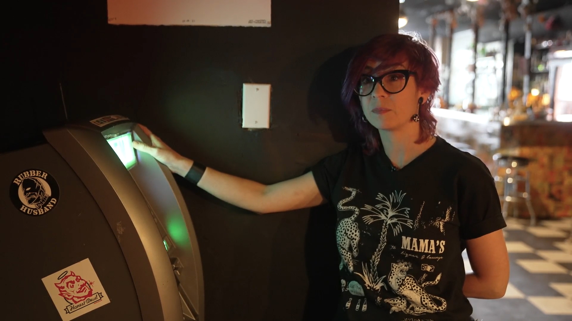 Abra standing beside the ATM in Swan Dive.