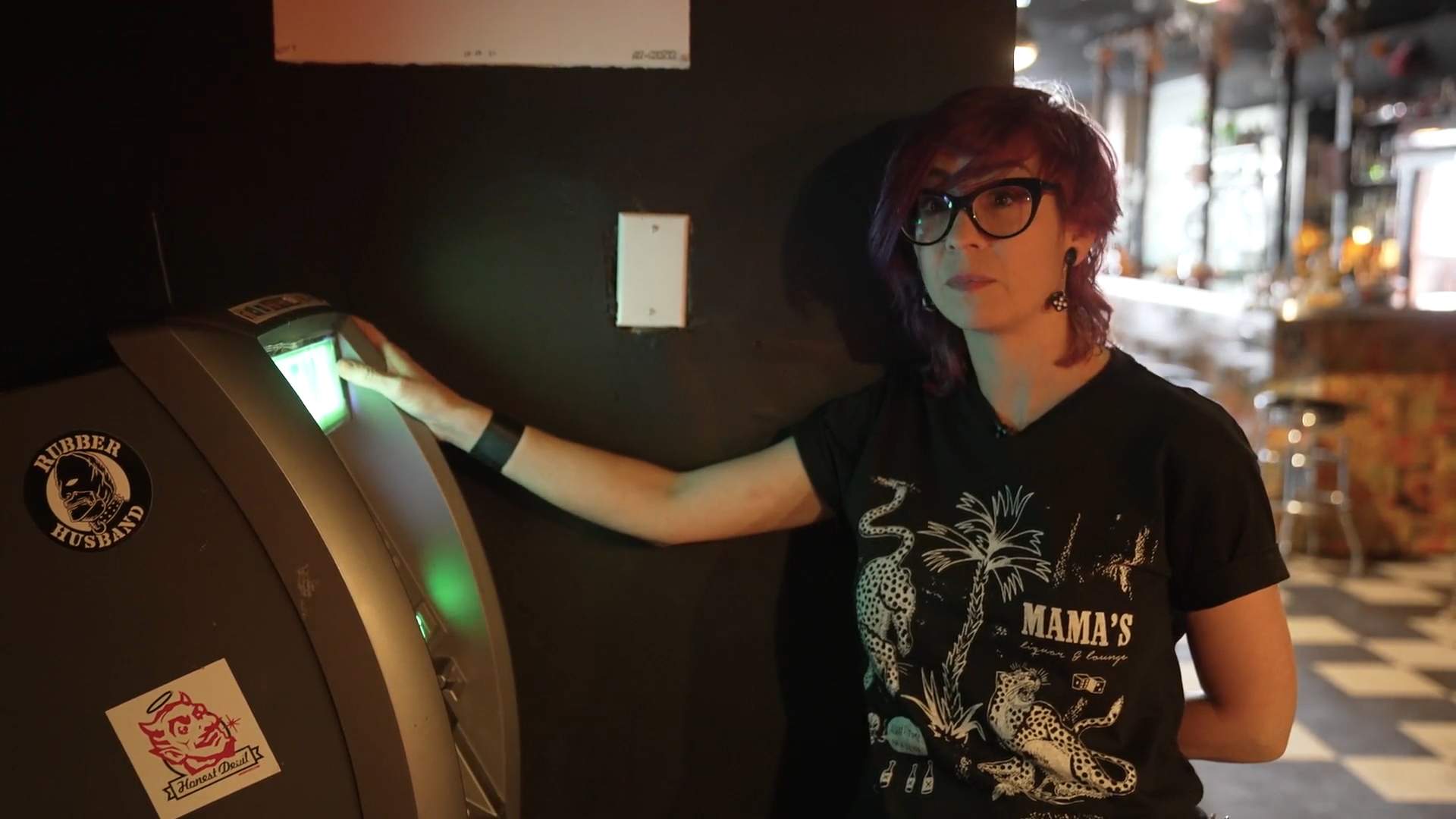 Abra standing beside the ATM in Swan Dive.