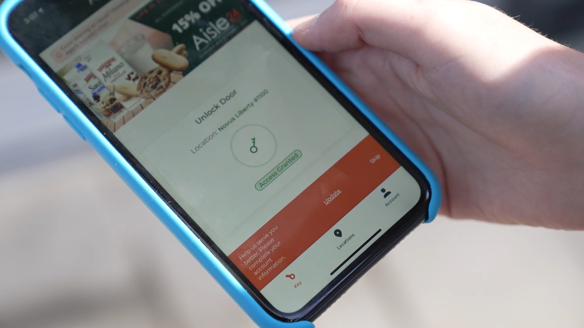 A customer using the Aisle 24 app to gain entry.