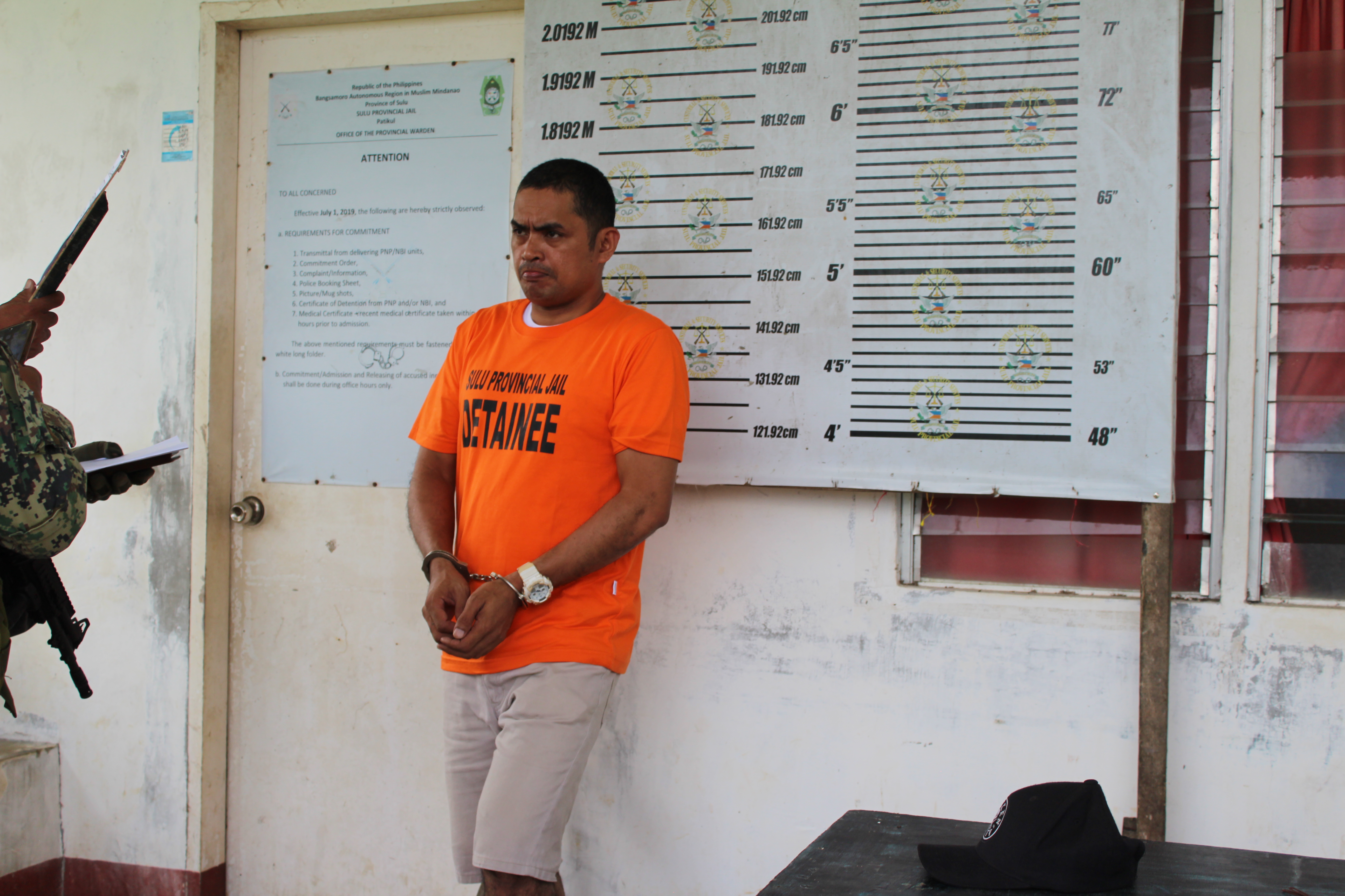 Philippine National Police Anti-Kidnapping Group take mugshots of Ben Tattoo, Oct. 4, 2022.