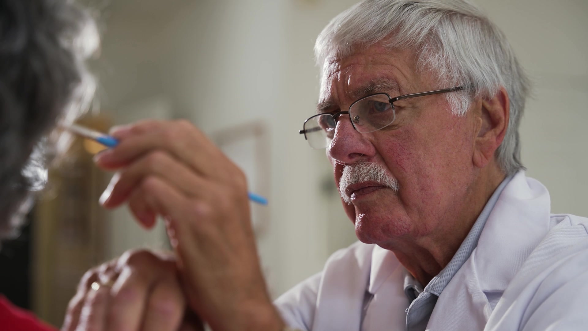 Robert Barron concentrates on matching exact skin tones for a silicone prosthetic.