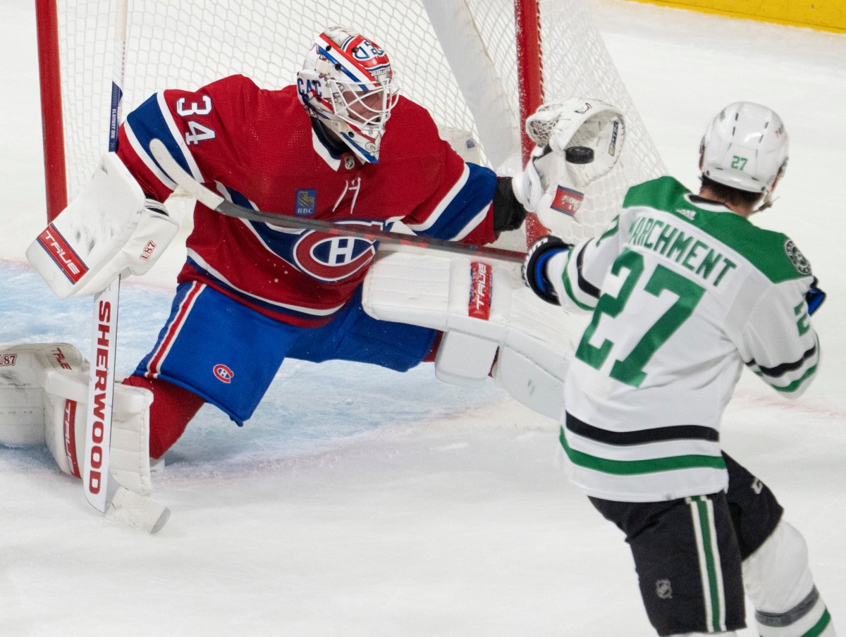 Montreal Canadiens goaltender Jake Allen (34) makes a glove save on Dallas Stars left wing Mason Marchment (27) during first period NHL hockey action Saturday, October 22, 2022 in Montreal. THE CANADIAN PRESS/Ryan Remiorz.