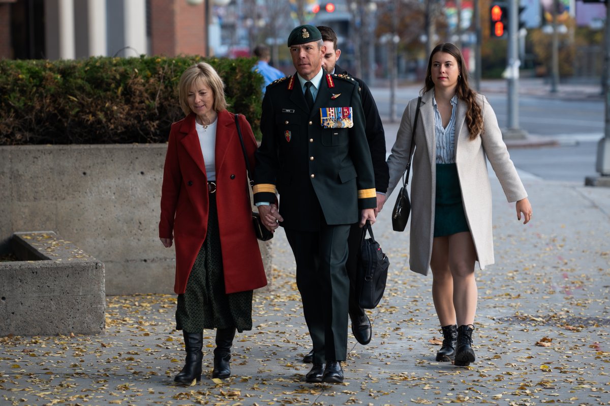 Maj.-Gen. Danny Fortin, right, arrives with his wife Madeleine Collin at a Gatineau, Que. courthouse on Monday, Oct. 24, 2022.