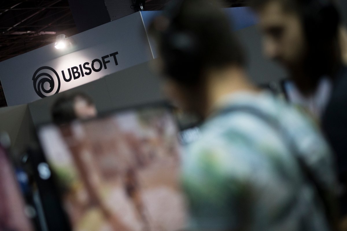 This Nov.3 2017 file photo shows visitors playing Assassin's Creed video game at the Ubisoft stand at the Paris Games Week in Paris. 