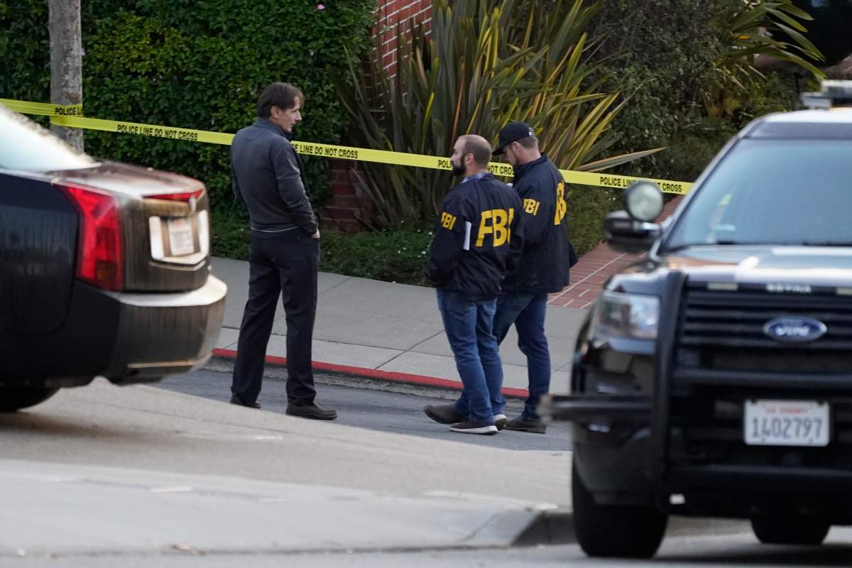 A pair of FBI agents work outside the home of Paul Pelosi, the husband of House Speaker Nancy Pelosi, in San Francisco, Friday, Oct. 28, 2022. Paul Pelosi, was attacked and severely beaten by an assailant with a hammer who broke into their San Francisco home early Friday, according to people familiar with the investigation. (AP Photo/Eric Risberg)