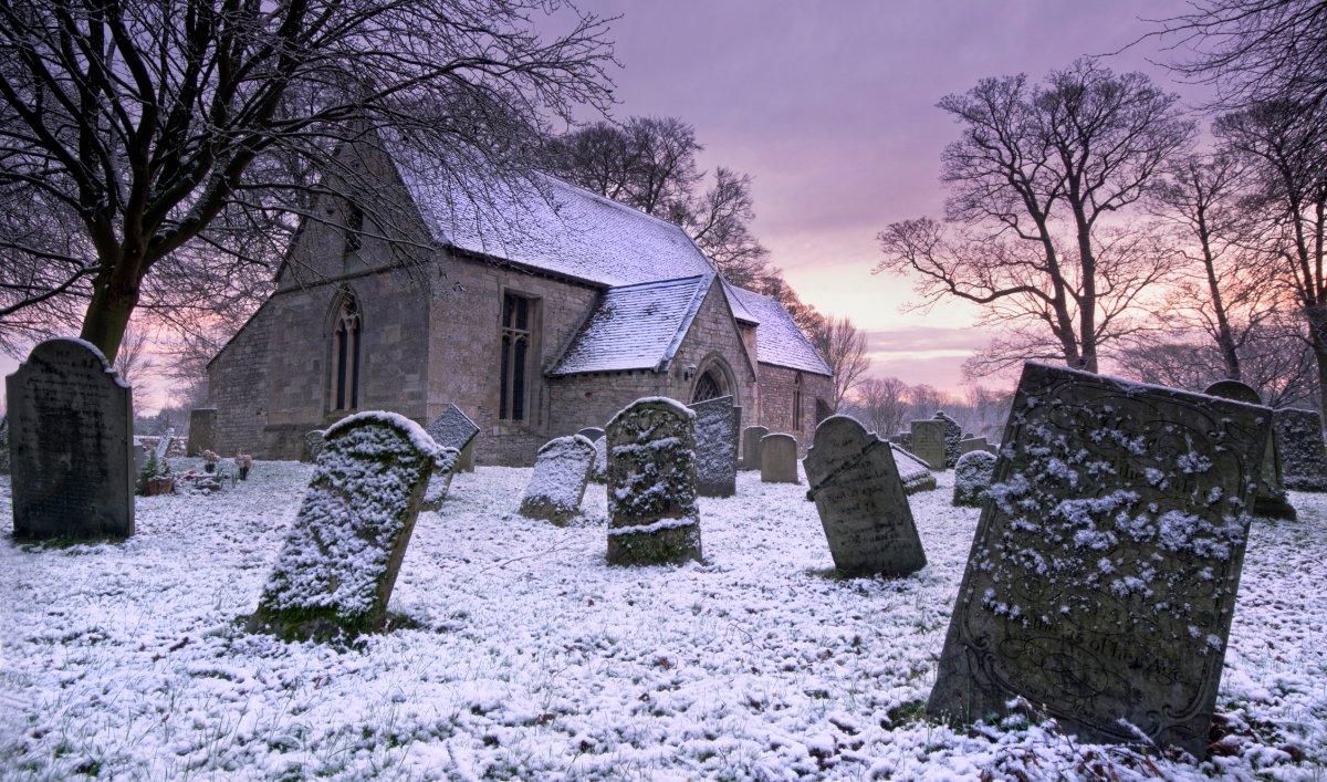 File - snowy church and cemetery.