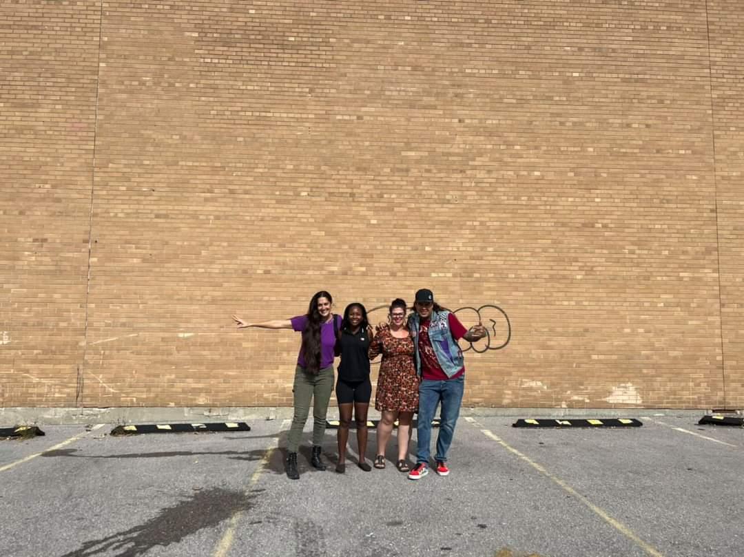 Artist Shalak Attack (Clandestinos) Shak’s World Owner Shanicka Edwards, Downtown Barrie BIA Communications and Public Realm Coordinator Sarah Jensen, and artist Bruno Smoky (Clandestinos) outside Shak’s World Community Centre on Maple Avenue.