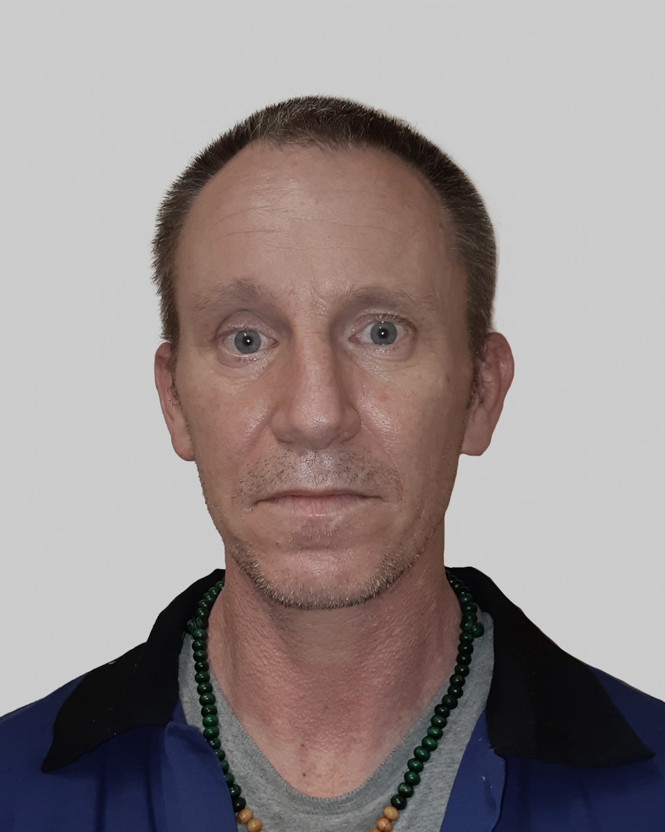John Malcolm, 46, is one of four men wanted on warrant for robbery.