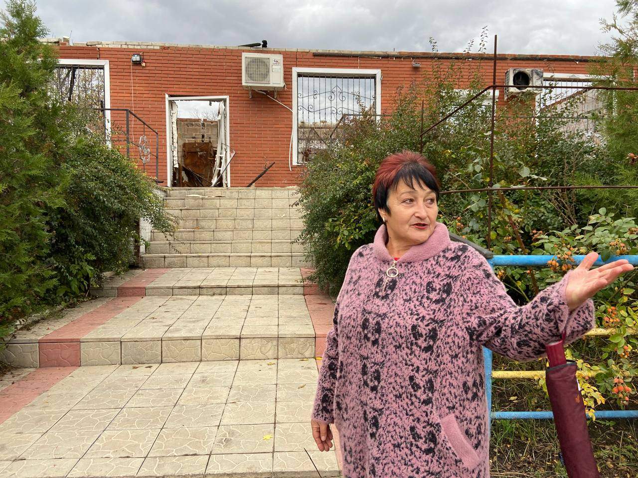 Vira Blokha, village head of Novyi Burluk, Ukraine, outside school occupied by Russian forces.